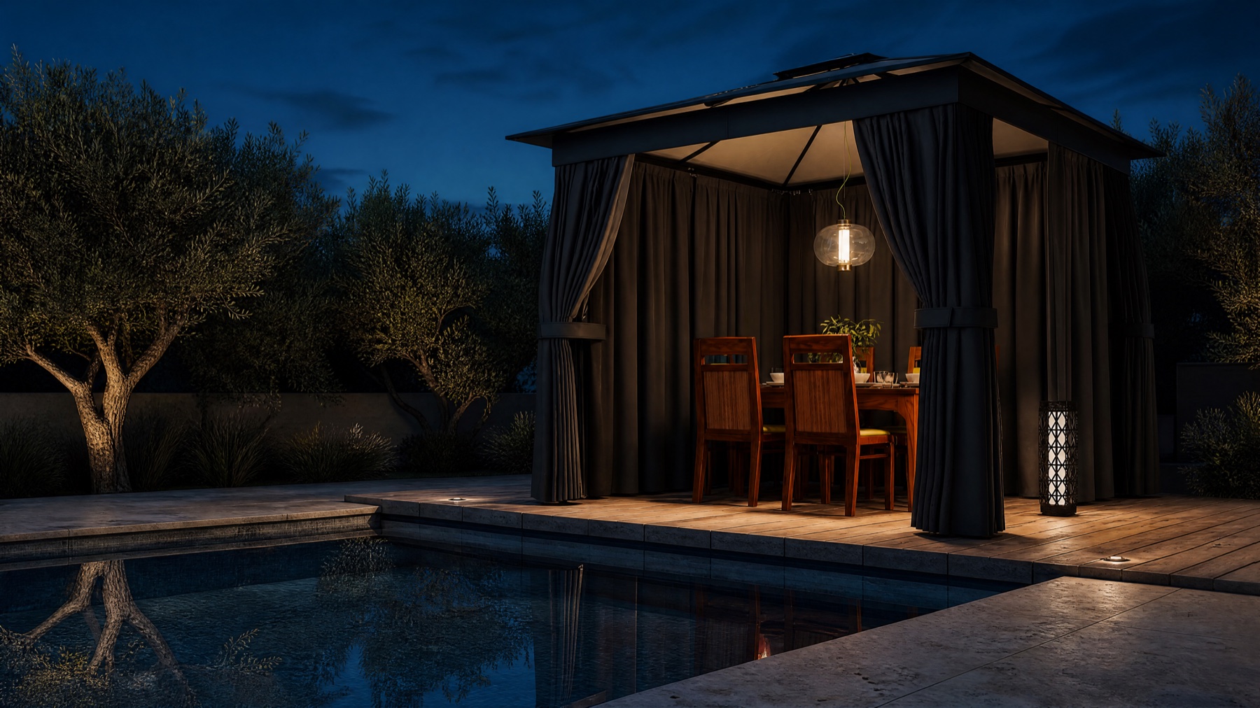 Privacy gazebo with curtains drawn beside a stone plunge pool at dusk